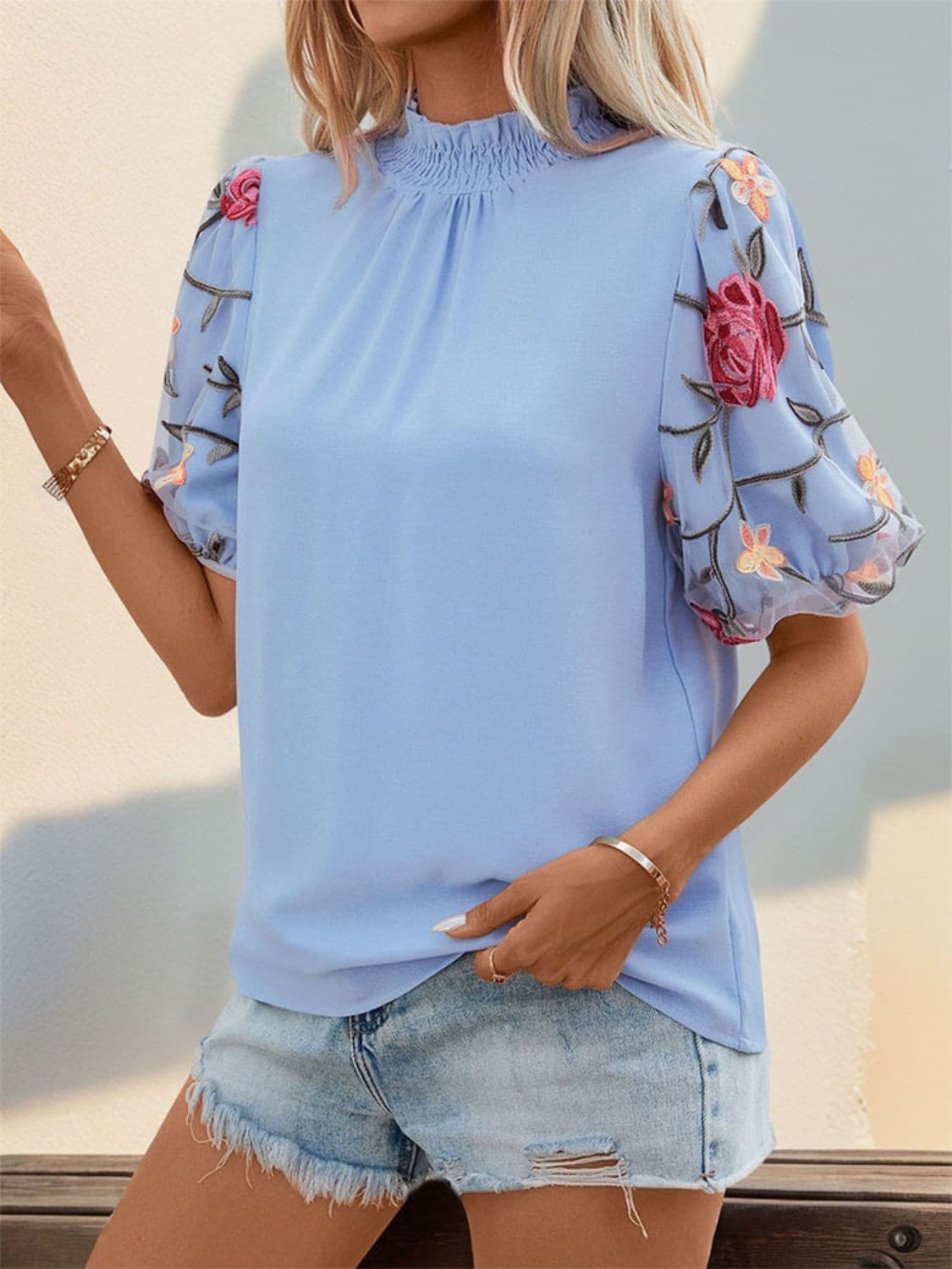 Embroidered Mock Neck Puff Sleeve Blouse.