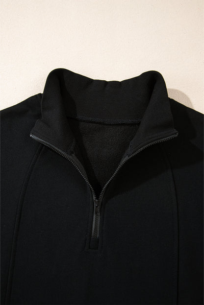 Chic black zip-neck sweatshirt with drop shoulder design