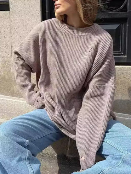 Chic distressed long sleeve sweater with a cozy round neck