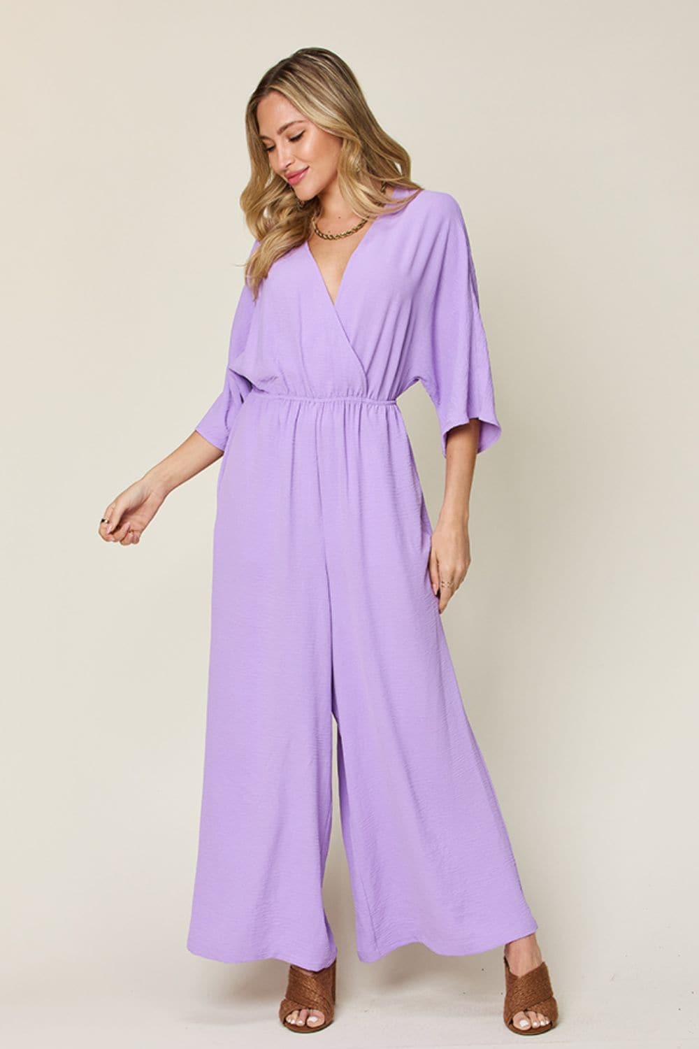 Double Take Full Size Surplice Wide Leg Jumpsuit with Pockets.