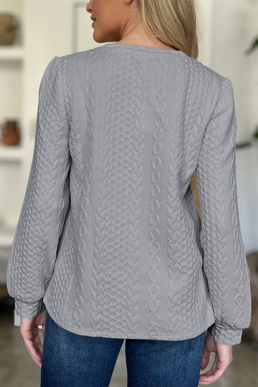 Textured Round Neck Long Sleeve Sweatshirt.