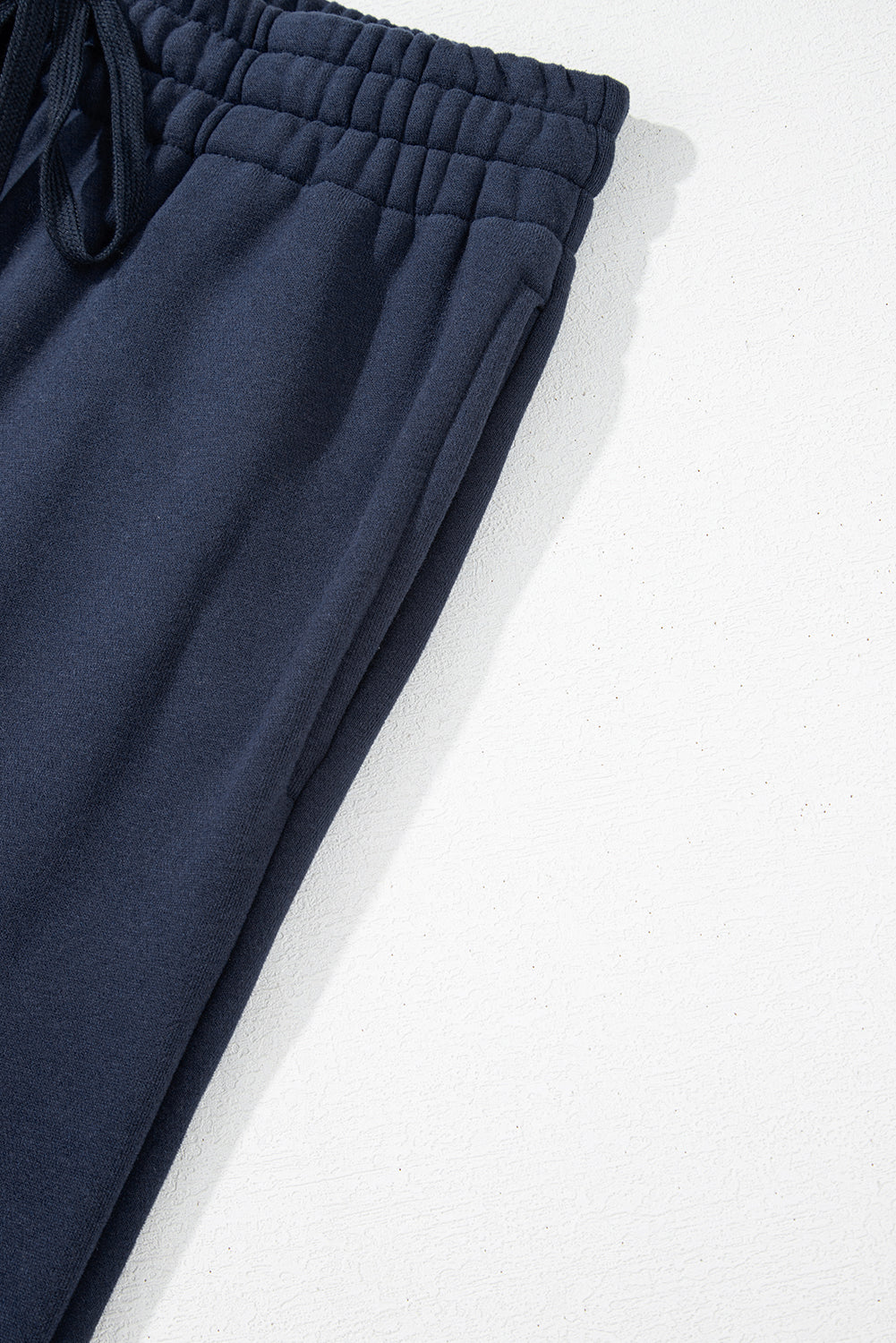 Navy blue fleece pants with drawstring