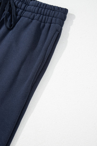 Navy blue fleece-lined casual pants with drawstring waist