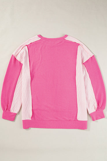 Chic cable knit colorblock sweatshirt with exposed seams