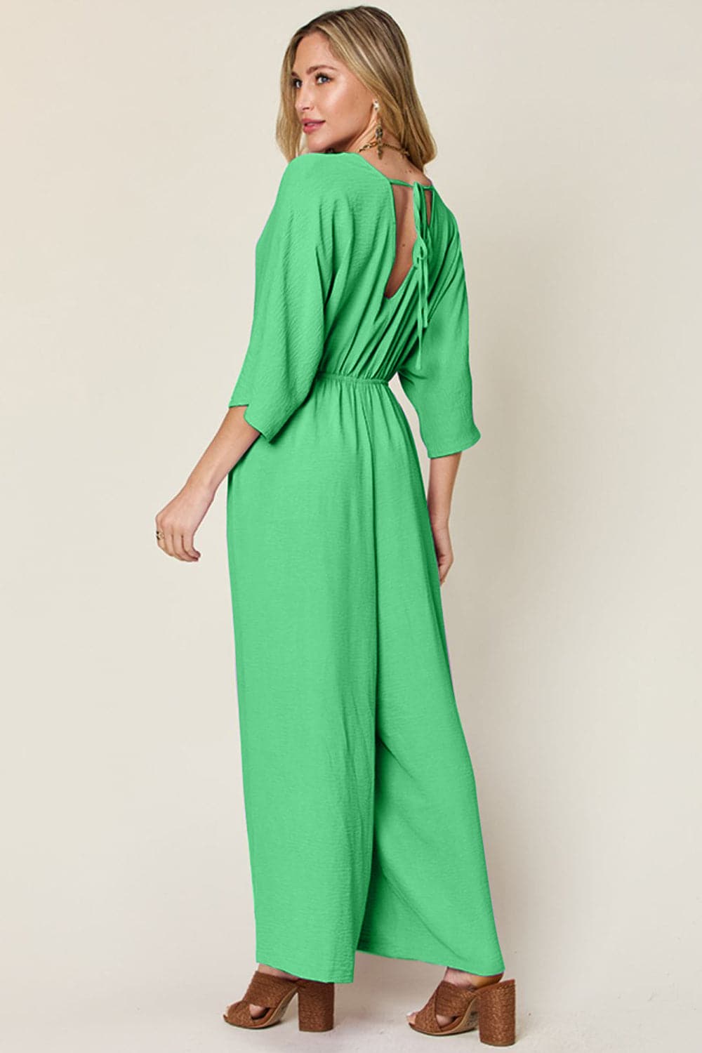 Double Take Full Size Surplice Wide Leg Jumpsuit with Pockets.