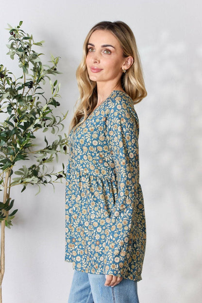 Heimish Full Size Floral Half Button Long Sleeve Blouse.