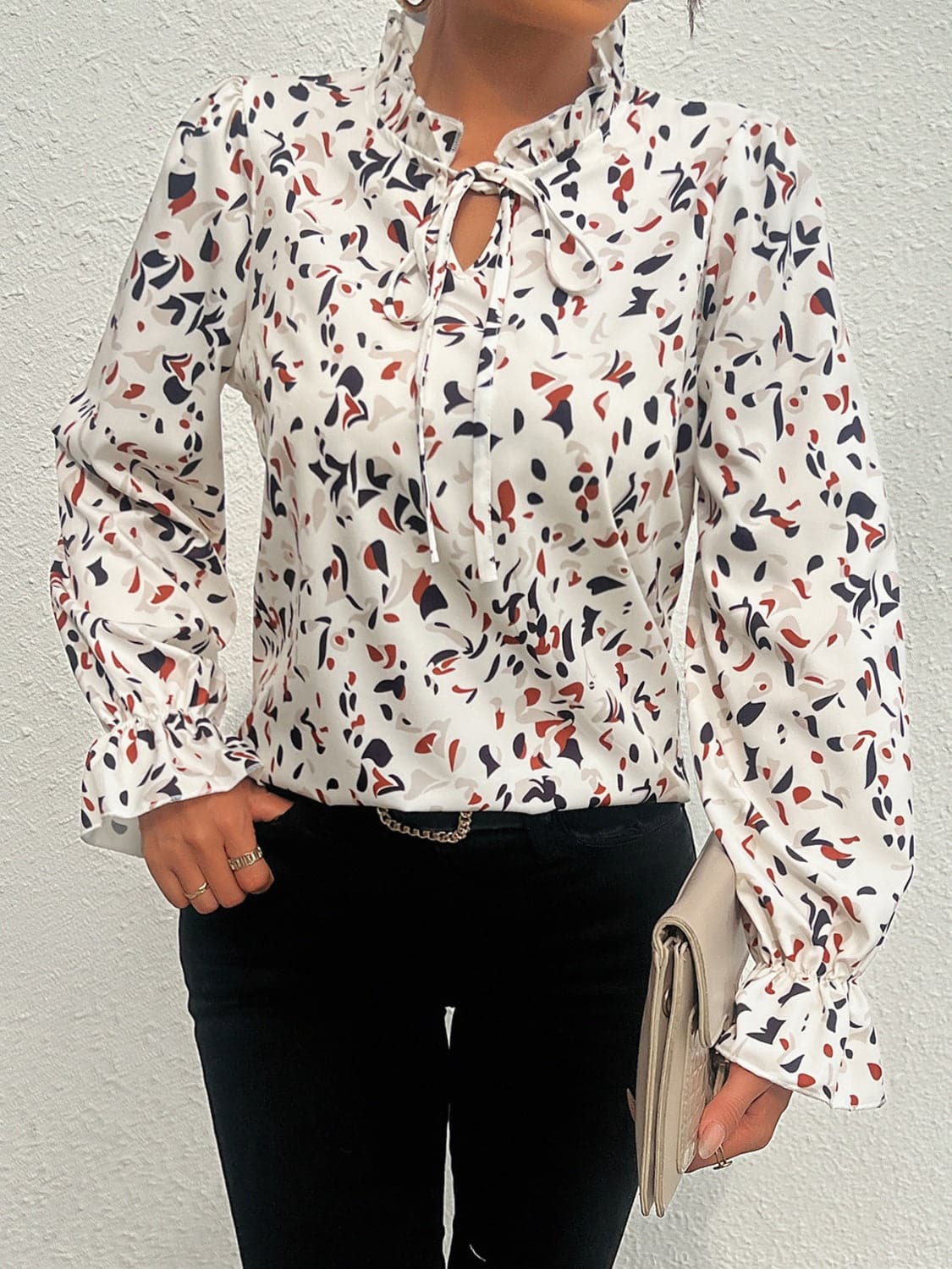 Ruffled Printed Tie Neck Long Sleeve Blouse.