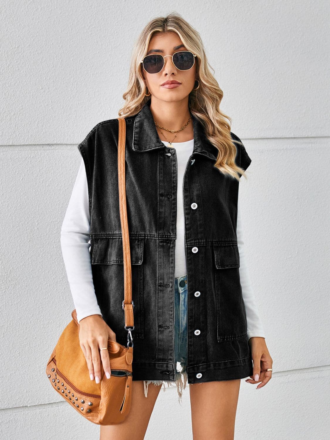 Pocketed Button Up Sleeveless Denim Jacket.