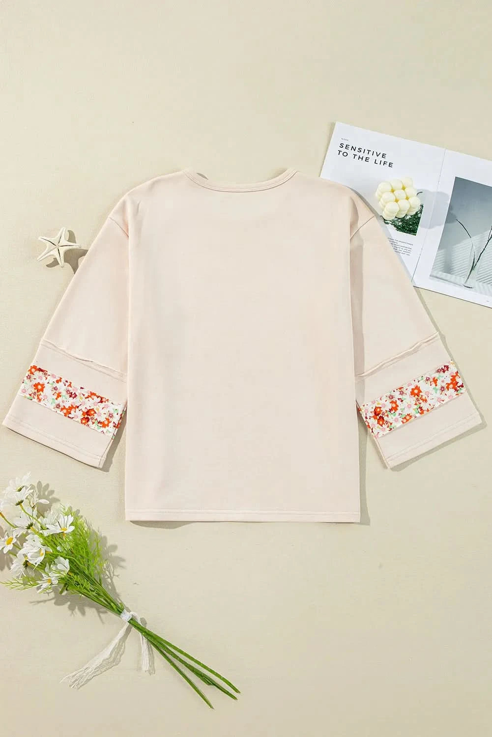 Floral round neck blouse with exposed seams and slits