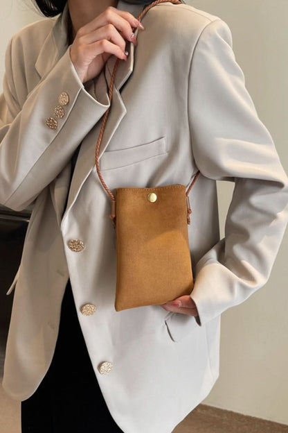 Chic mini suede crossbody bag with snap closure