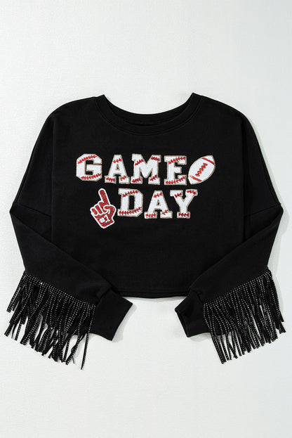 Sparkle on game day with a black cropped rugby sweatshirt featuring tassels and sequins