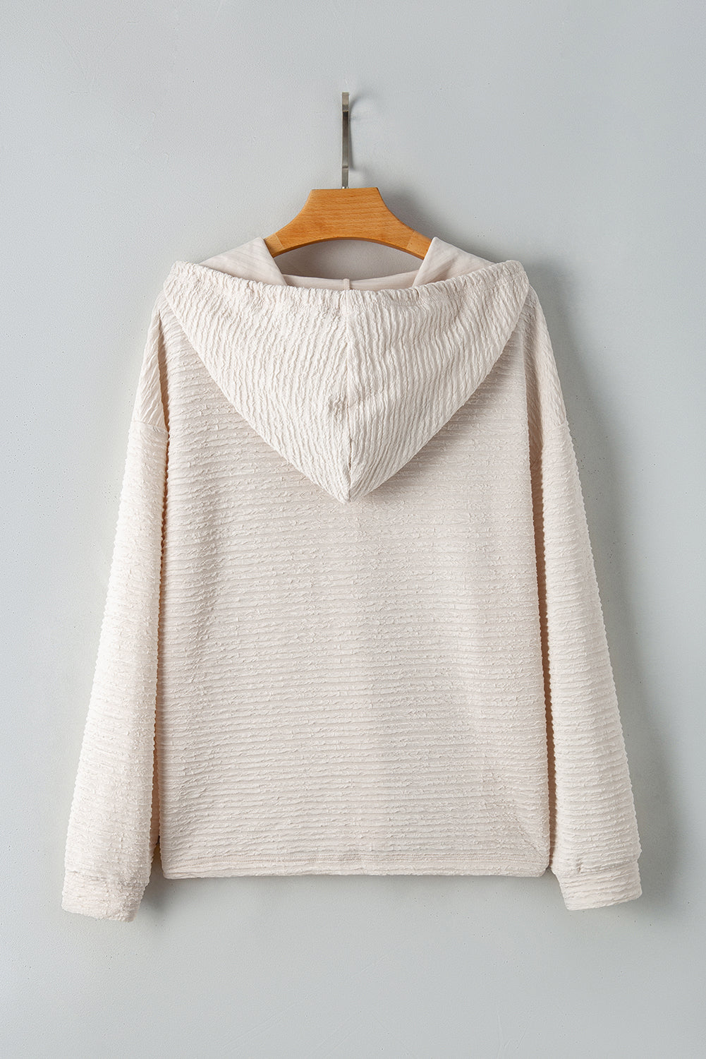 Apricot textured drawstring hoodie with buttoned neckline