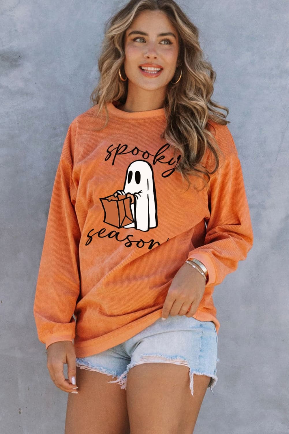 Spooky Season Graphic Sweatshirt with ghost design, cozy and stylish for fall.