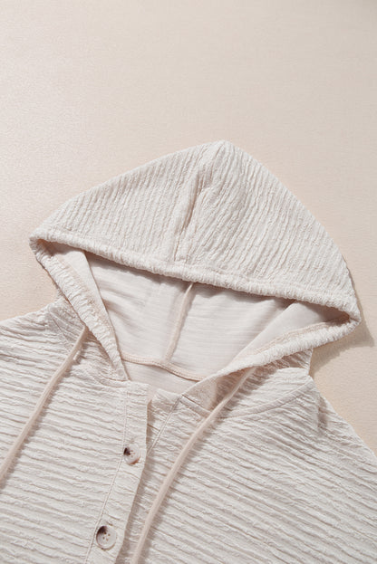 Apricot textured drawstring hoodie with buttoned neckline