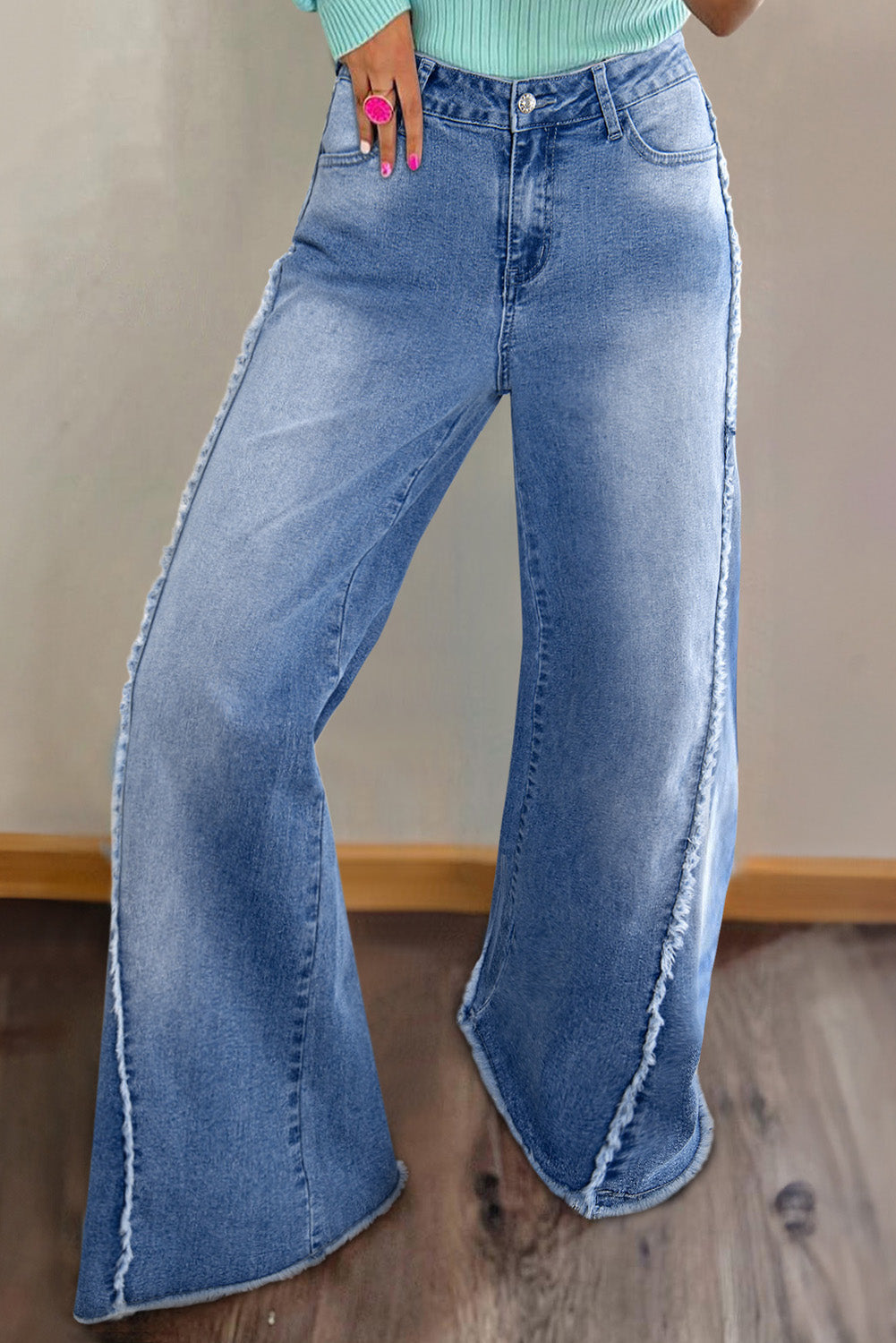 Vintage-inspired Beau Blue flared jeans with raw hem detailing