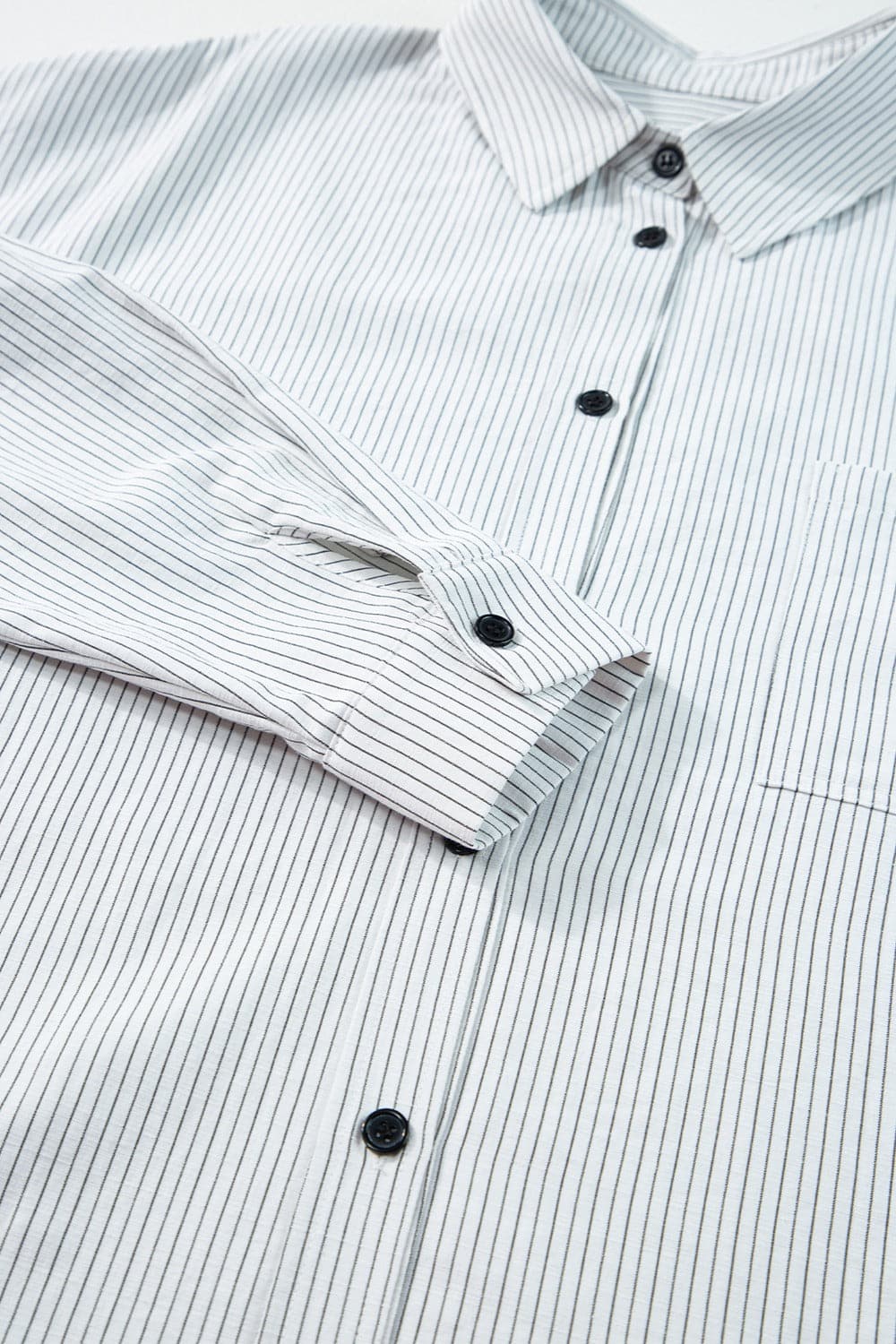 Pocketed Striped Collared Neck Long Sleeve Shirt.