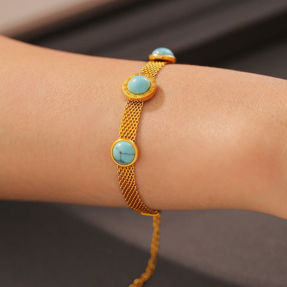 Elegant turquoise and gold-plated titanium bracelet