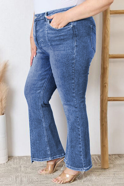 Stylish blue high-waist plus size flare jeans with exposed seam detail