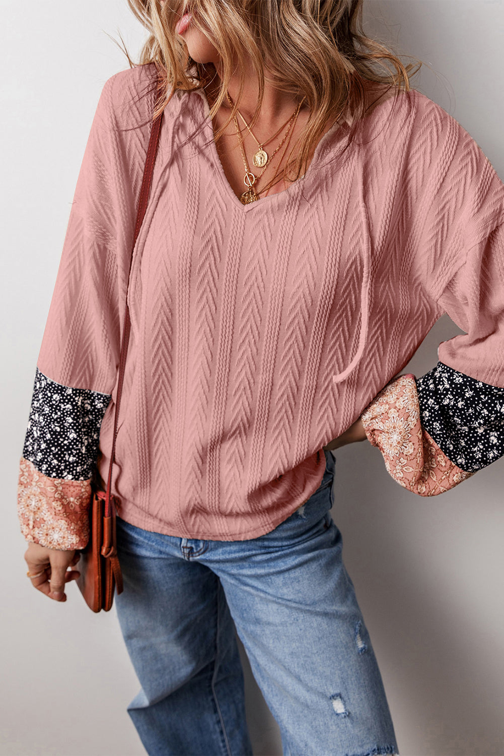 Dusty pink floral patchwork v-neck blouse with textured knit and drawstring detail