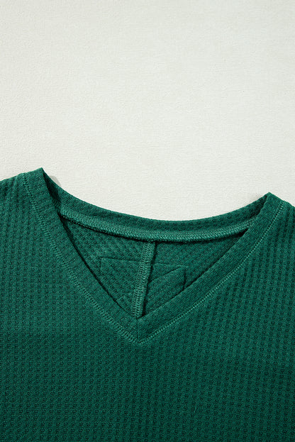 Chic blackish green waffle knit V-neck long sleeve blouse with drop shoulders