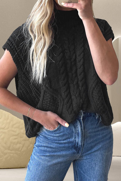 Cozy cable-knit mock neck sweater featuring a stretchy material blend of 60% cotton and 40% acrylic, shown in black, paired with jeans.