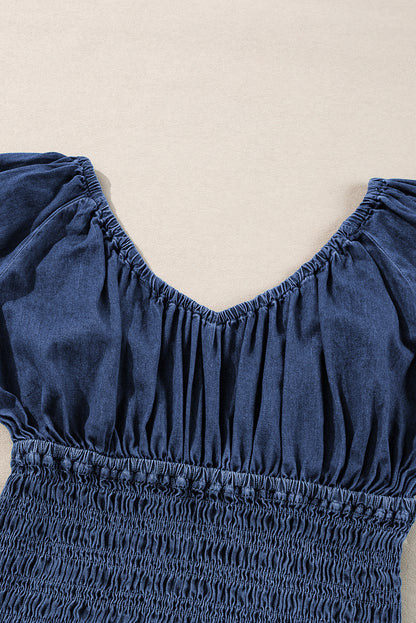 Chic dark blue ruffled puff sleeve denim blouse with smocked details