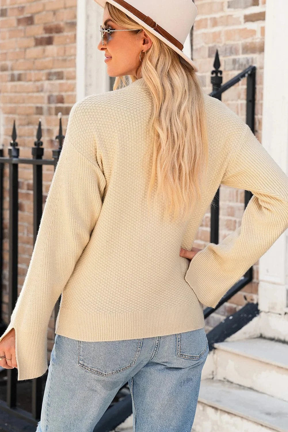 Chic textured long sleeve sweater with stylish slit detail