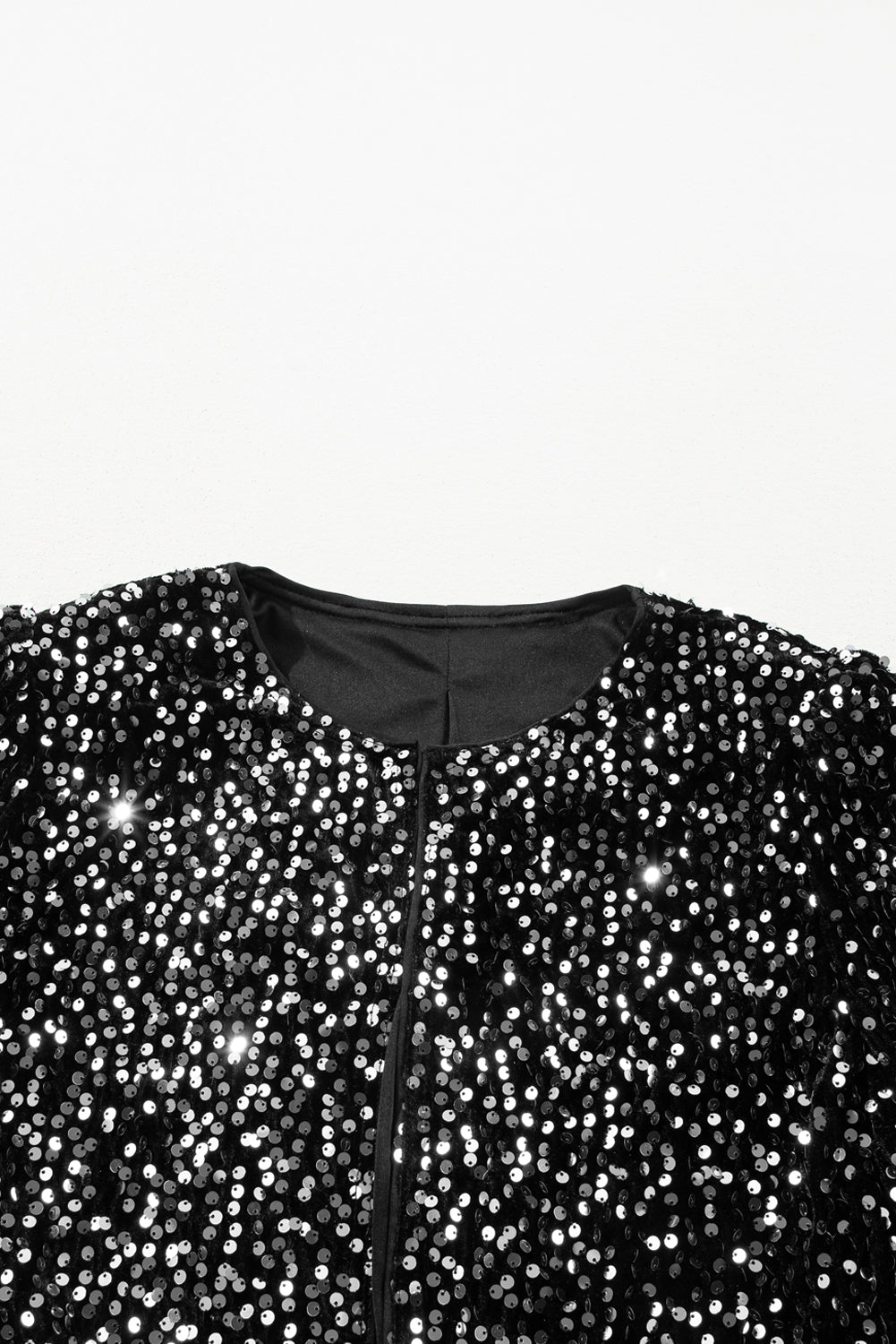 Sparkling black sequin cropped jacket with open front design