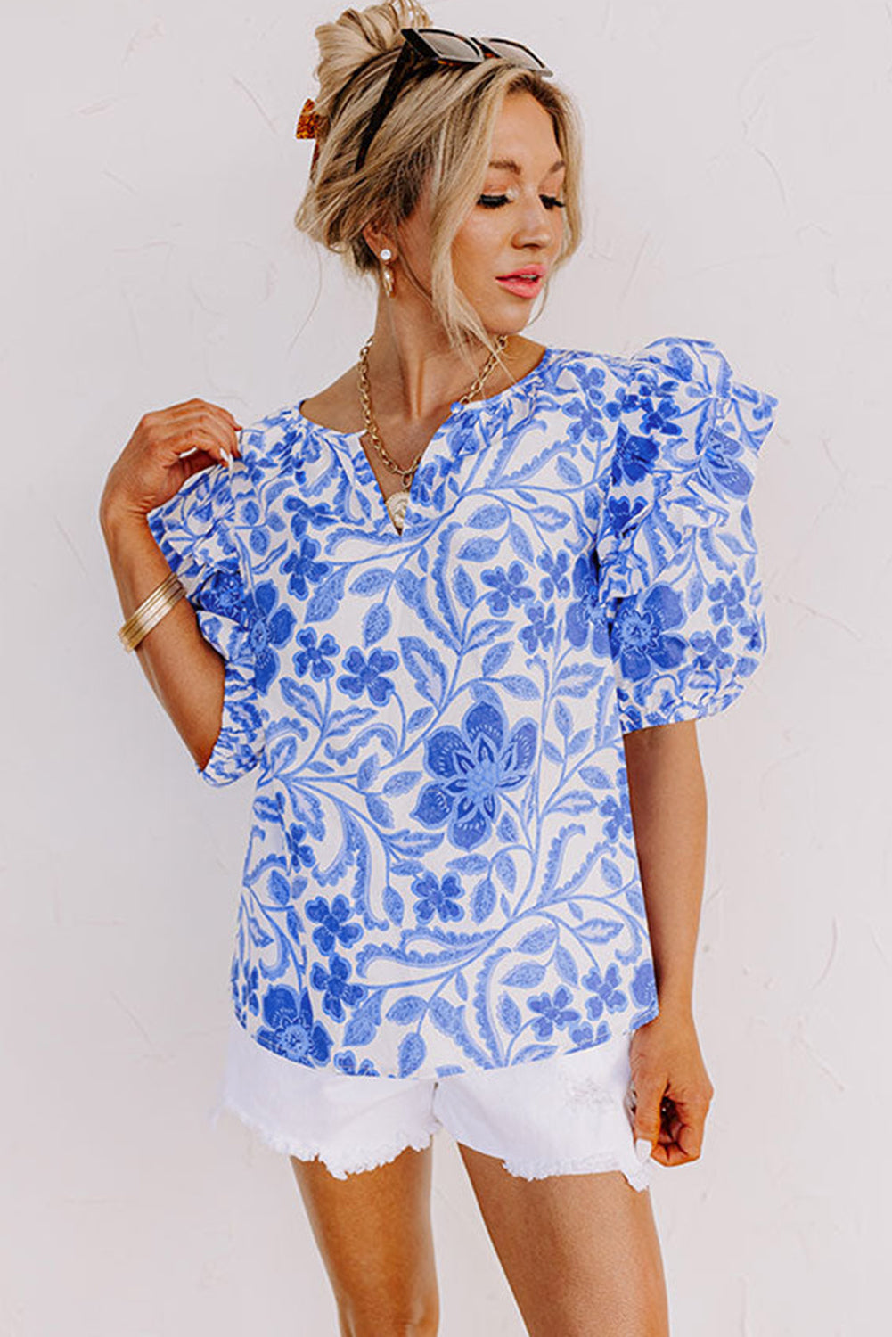 Elegant dark blue floral ruffled blouse with bubble sleeves