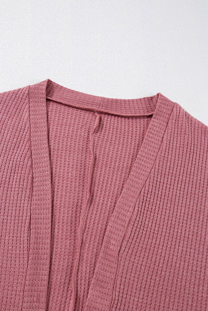 Cozy mineral red waffle knit cardigan with pocket detail