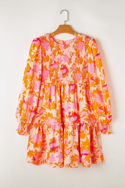 Eye-catching orange abstract smocked mini dress with ruffled lantern sleeves