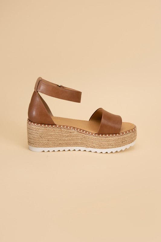 TUCKIN-S Platform Sandals.