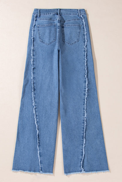 Vintage-inspired Beau Blue flared jeans with raw hem detailing