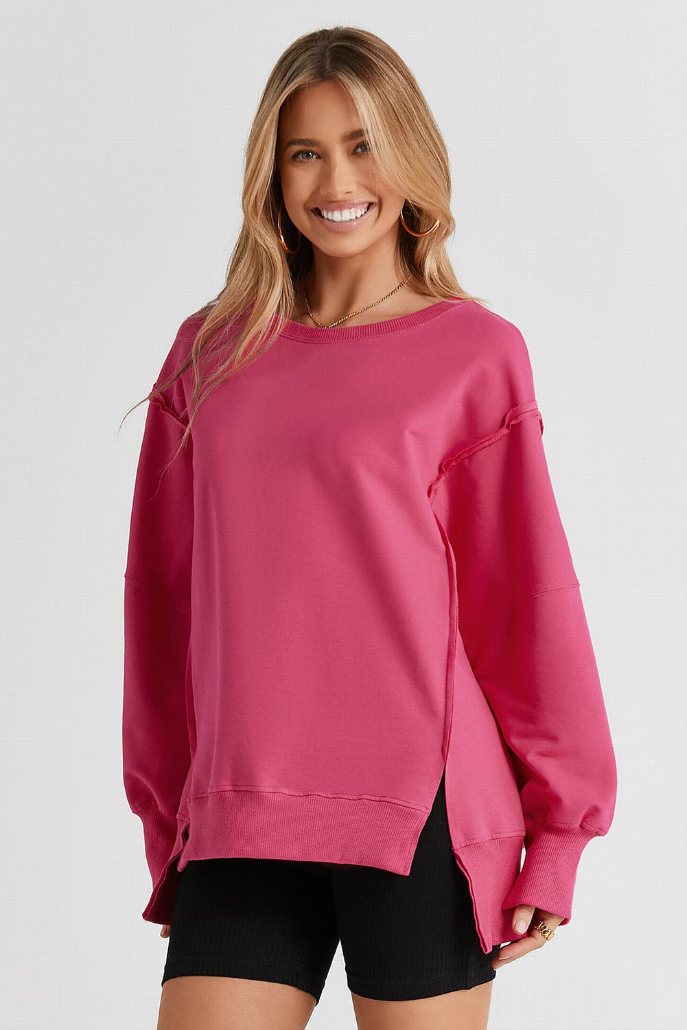 Slit Exposed Seam Round Neck Sweatshirt.