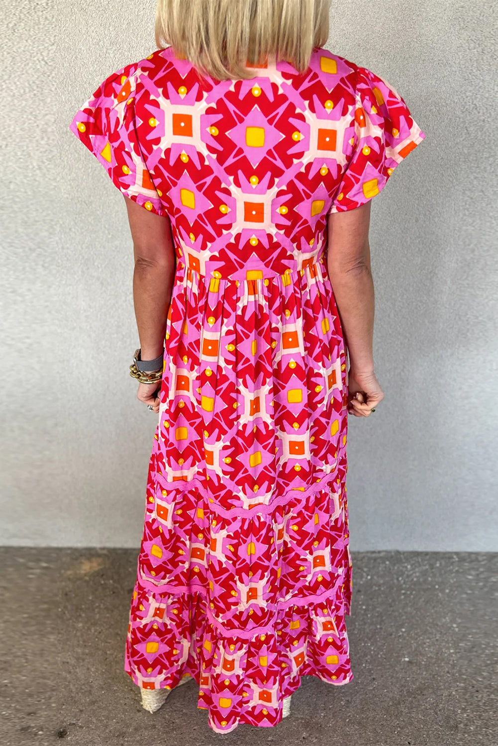 Vibrant strawberry pink geo print maxi dress with V-neckline