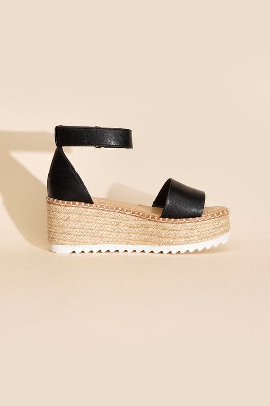 TUCKIN-S PLATFORM SANDALS.