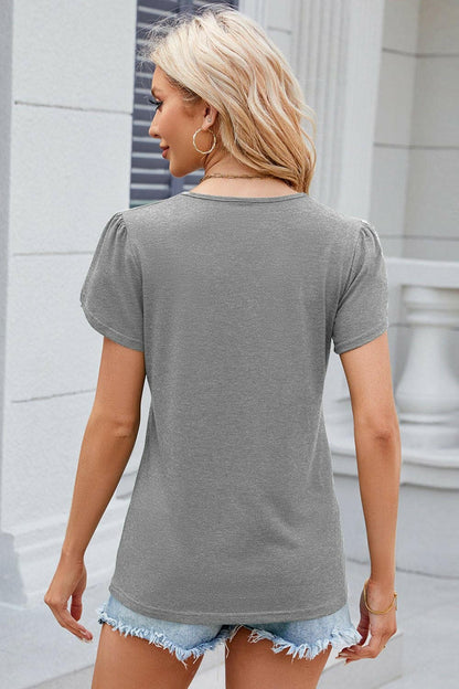 Chic V-Neck T-Shirt with Decorative ButtonsUpgrade Your Style with Our Chic V-Neck T-Shirt
 
 
Chic Design: Elevate your wardrobe with decorative buttons and a trendy V-neck.
 
Versatile: Whether for a casualLove Salve Decorative Buttonsjust arrived