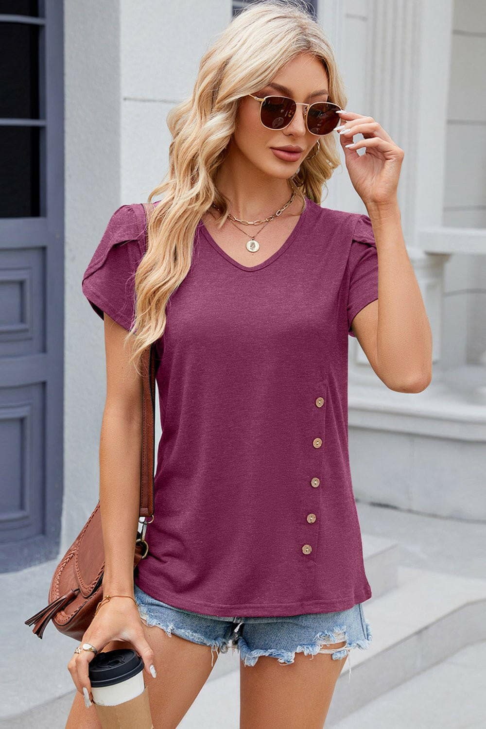 Chic V-Neck T-Shirt with Decorative ButtonsUpgrade Your Style with Our Chic V-Neck T-Shirt
 
 
Chic Design: Elevate your wardrobe with decorative buttons and a trendy V-neck.
 
Versatile: Whether for a casualLove Salve Decorative Buttonsjust arrived