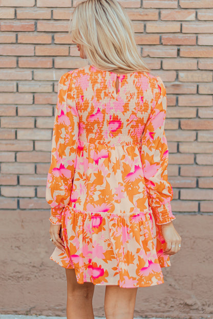 Eye-catching orange abstract smocked mini dress with ruffled lantern sleeves