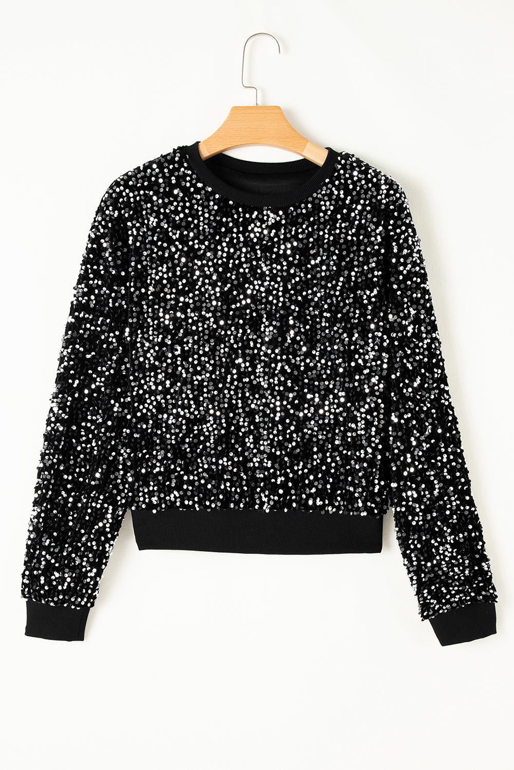 Glamorous black sequined cropped blouse with long sleeves