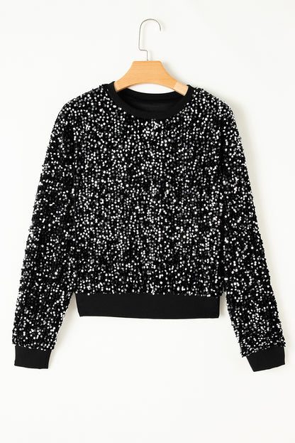 Glamorous black sequined cropped blouse with long sleeves