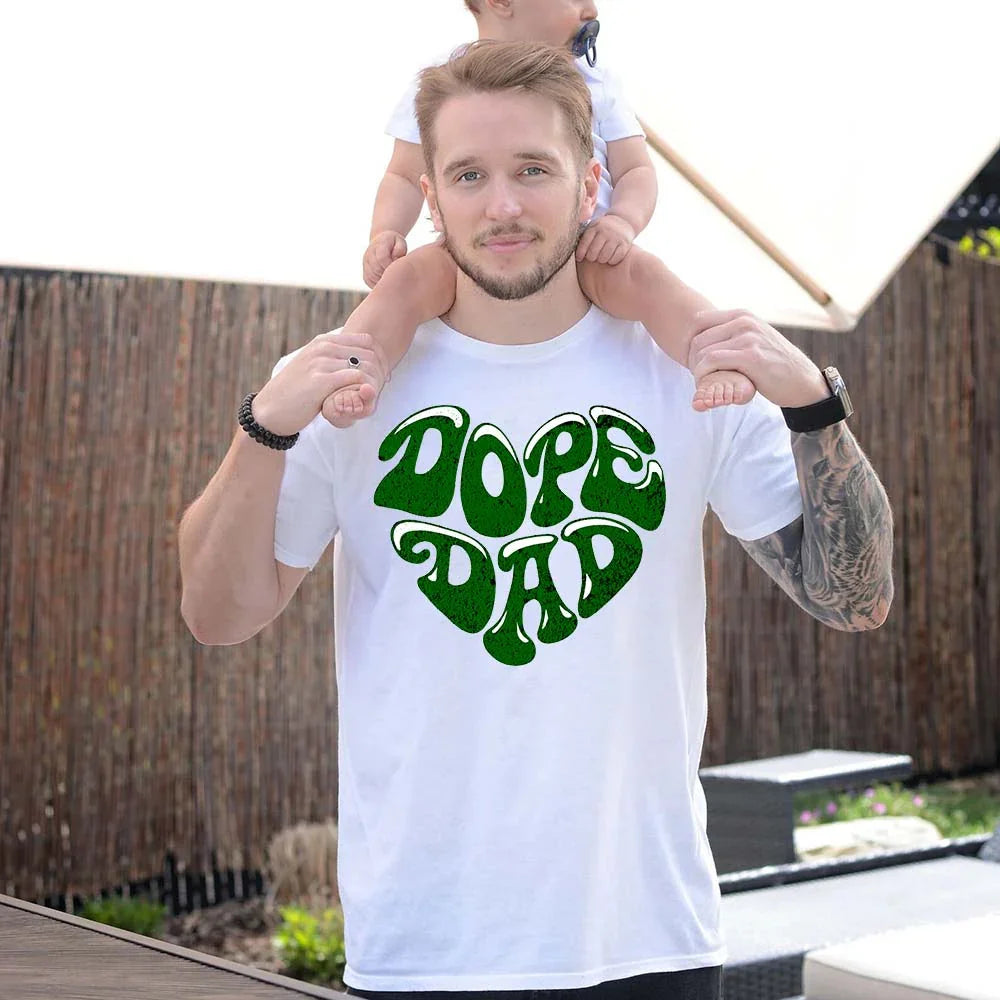 Adorb.co Dope Dad Retro Graphic T-Shirt worn by a dad enjoying family time, a perfect Father's Day Gift that combines style a