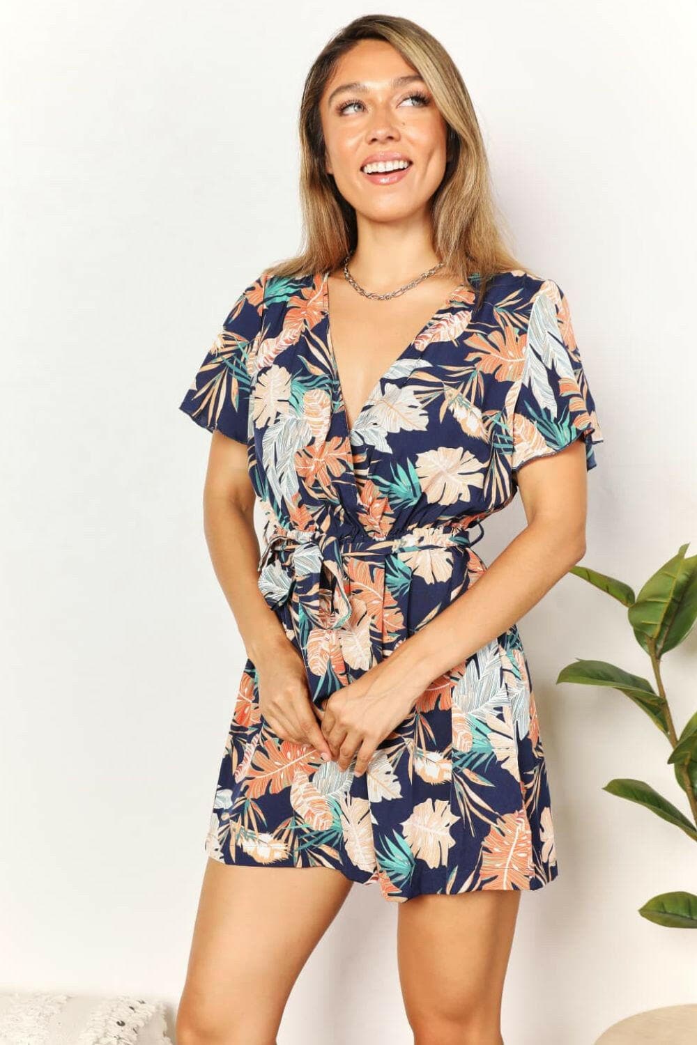 Blossoming Botanical V-Neck Tie JumpsuitEmbrace Style and Elegance with Our Blossoming Botanical V-Neck Tie Jumpsuit
 Step into any summer event or special occasion exuding freshness and sophistication witLove Salve -Neck Tie JumpsuitTIKTOK