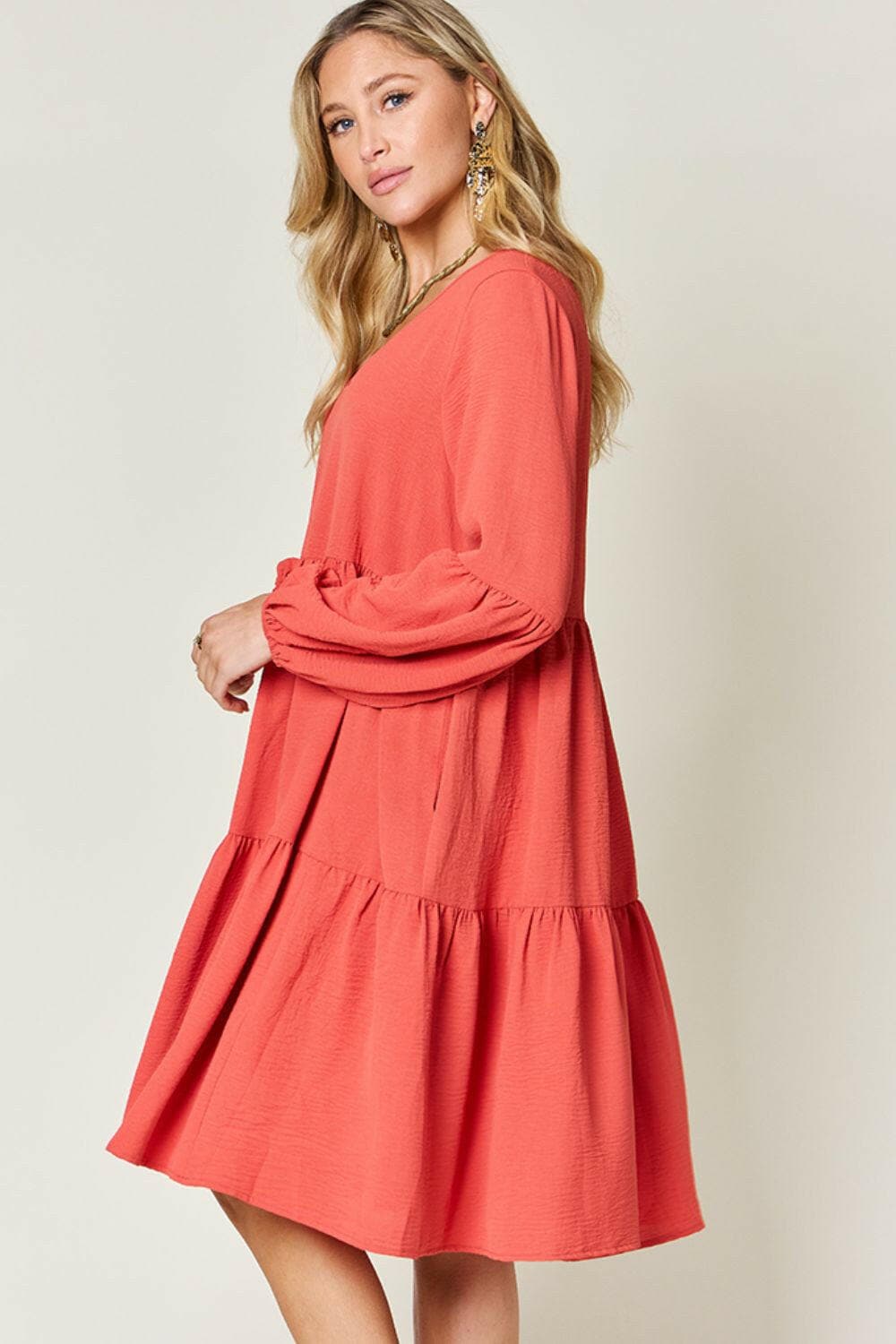 Double Vision V-Neck Balloon Sleeve Tiered DressDouble Vision V-Neck Balloon Sleeve Tiered Dress
 Step into the spotlight with our Double Vision V-Neck Balloon Sleeve Tiered Dress, a masterpiece designed to turn hLove Salve -Neck Balloon Sleeve Tiered DressColor