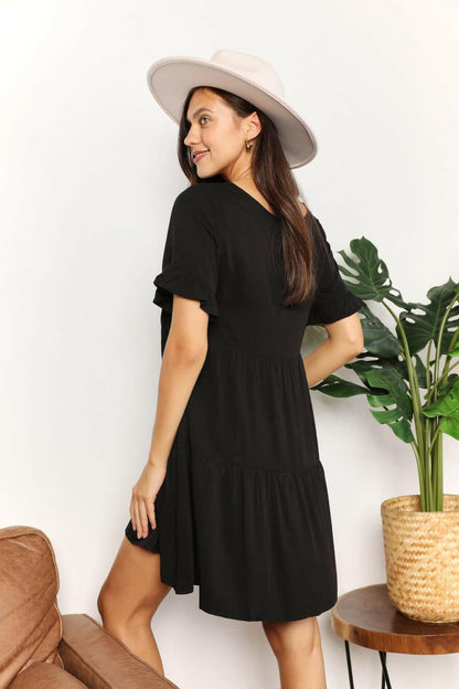 Flounce Sleeve V-Neck Tiered DressElevate Your Wardrobe with Our Flounce Sleeve V-Neck Tiered Dress
 Embrace a perfect blend of sophistication and playfulness with our Flounce Sleeve V-Neck Tiered DrLove Salve -Neck Tiered DressTIKTOK