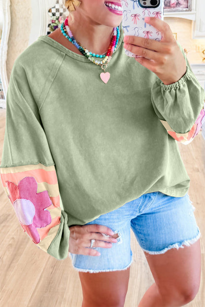 Floral patchwork oversized top with exposed seams in smoke green