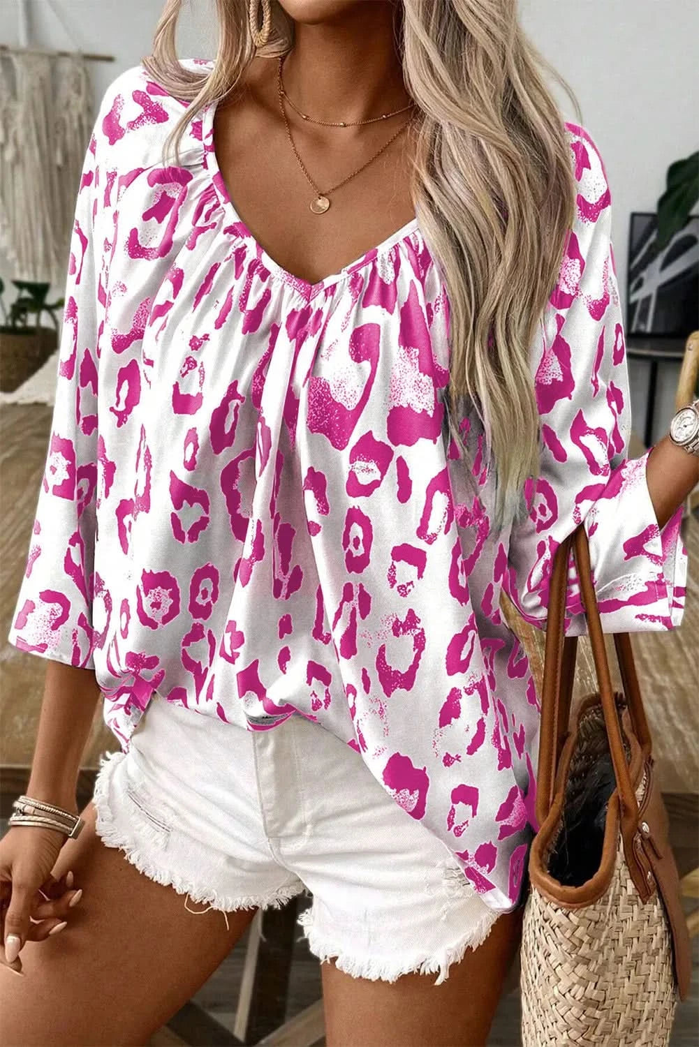 Leopard-print v-neck blouse with three-quarter sleeves