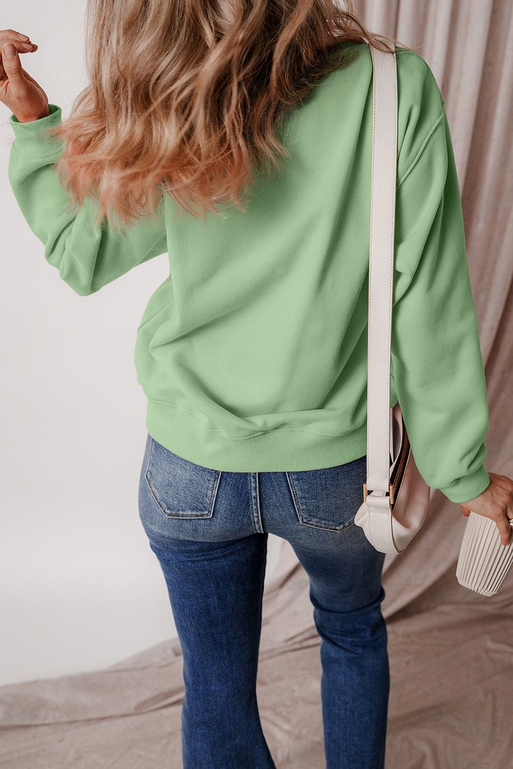 Cozy smoke green fleece-lined sweatshirt with drop shoulder design