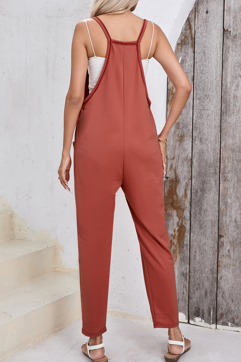 Chic gold flame harem jumpsuit with side pockets and sleeveless design