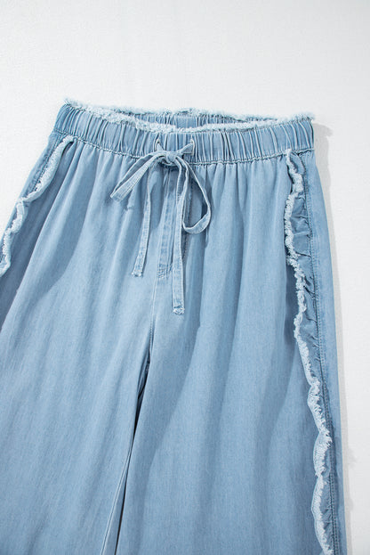 Myosotis light wash ruffled wide leg jeans with raw hem detail